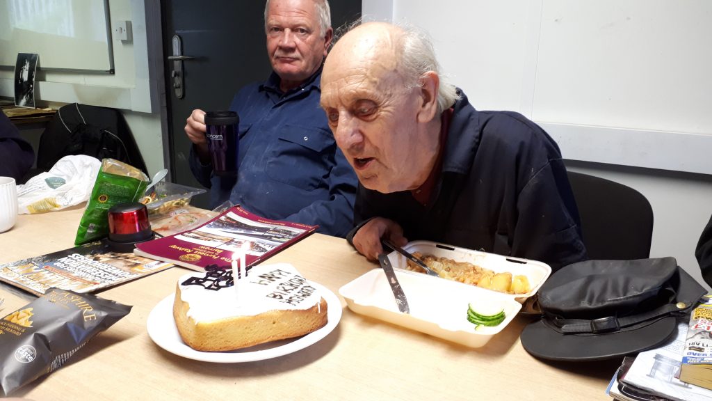 Howard blowing out his candles