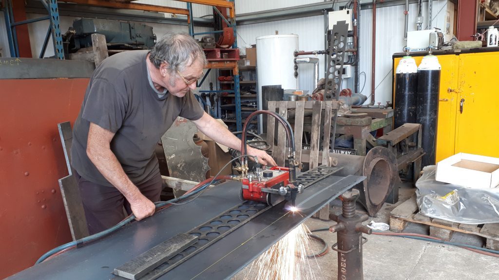 Keith cutting new steel plate for Fluff's running board