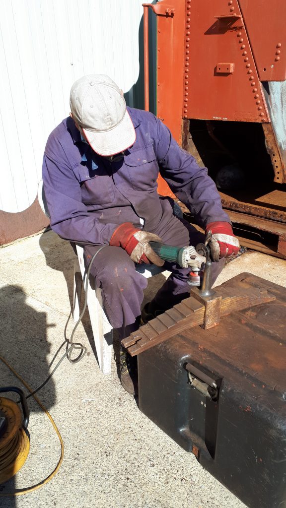 John Davis cleaning up one of Fluff's springs