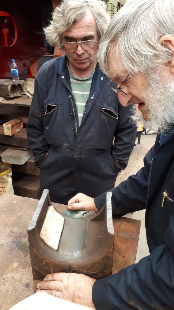 Alan and Adrian with a new felt pad in one of Caliban's axleboxes