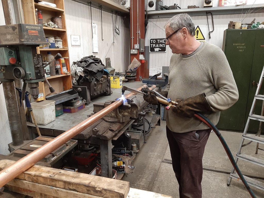 Keith shaping one of Wootton Hall's injector delivery pipes