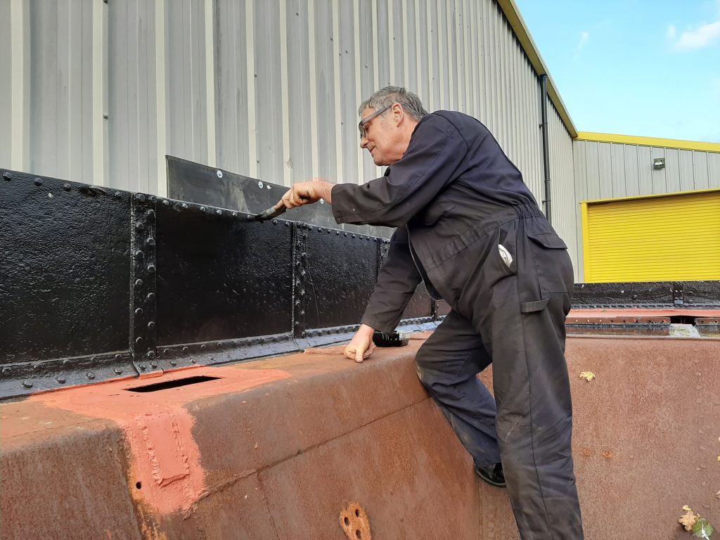 Keith painting Wootton Hall's tender top