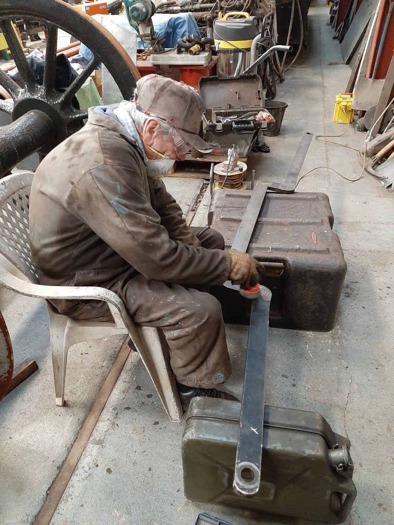 Fred cleans up one of FR 20's tender brake rods