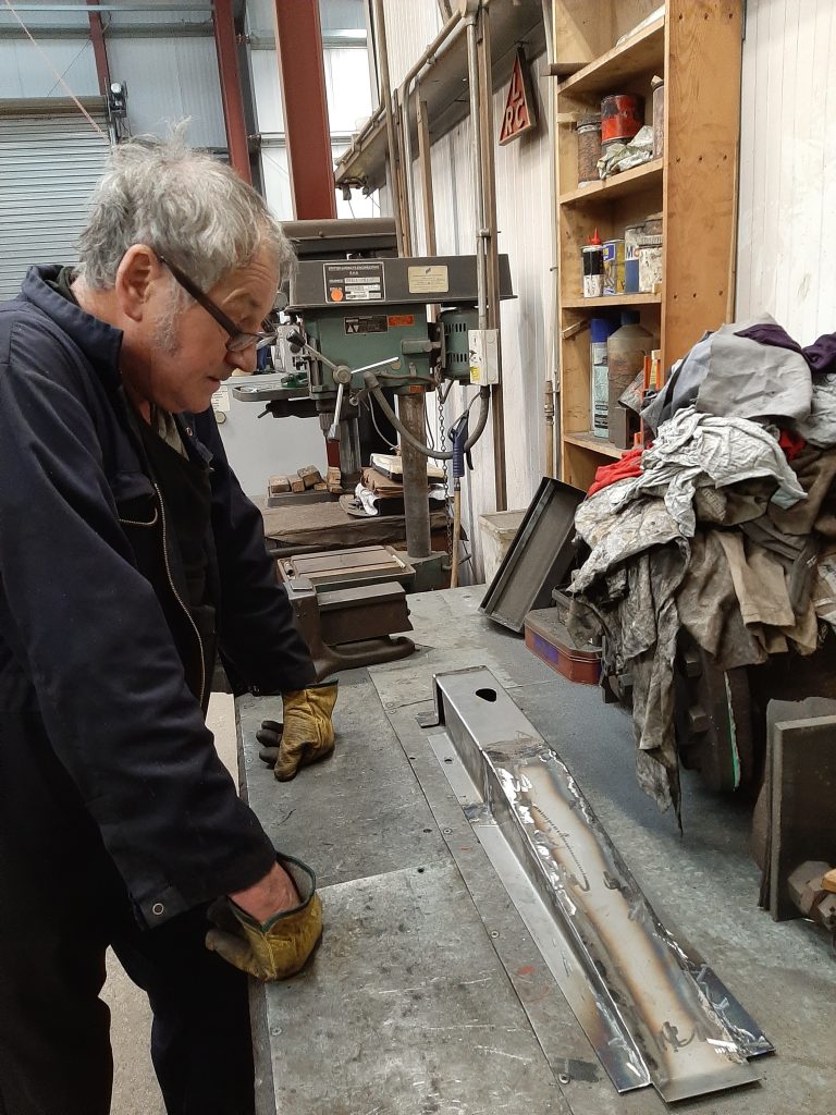 Keith with the left hand cover for the lubrication valves on Wootton Hall's smokebox