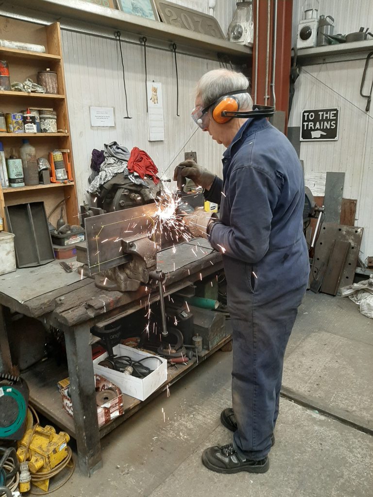 John Dixon making the sparks fly whilst making a modification to FR 20's tender drawgear