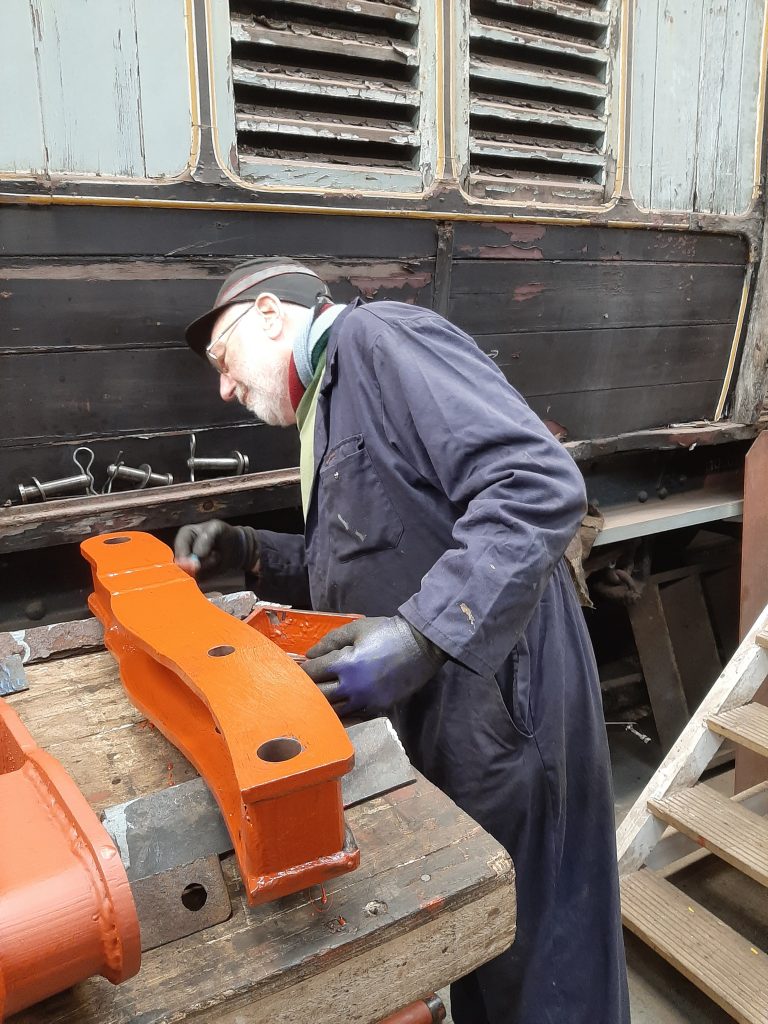 Phil Bell painting one of FR 20's tender brake hangers