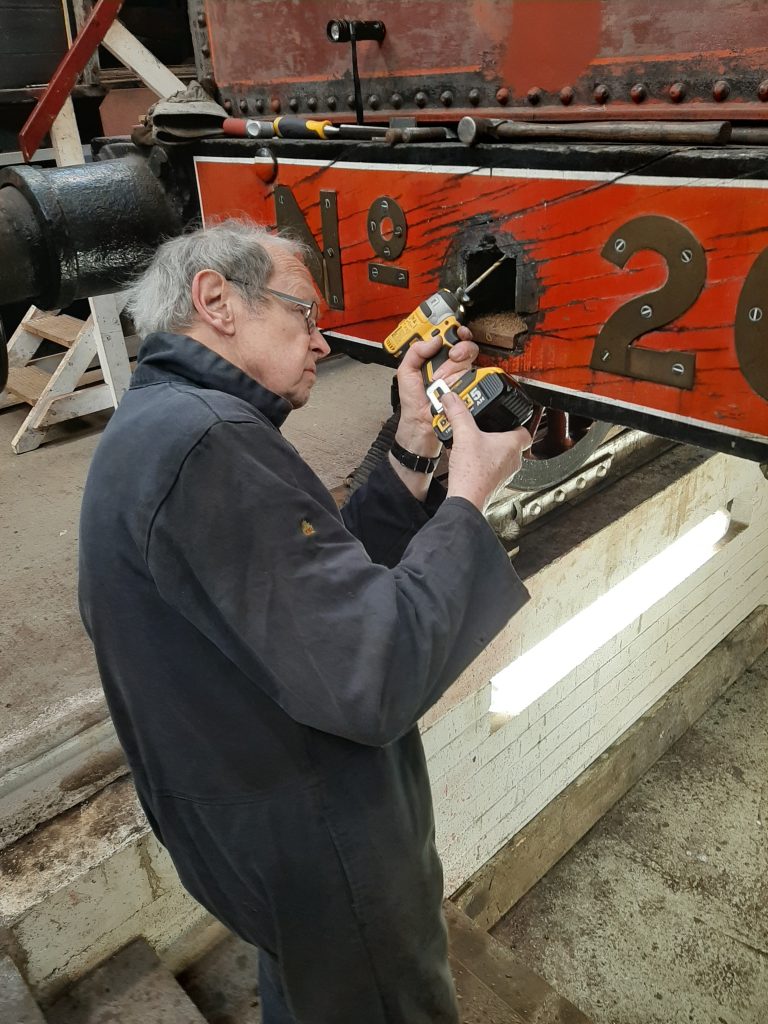 John Dixon repairing FR 20's tender drawgear