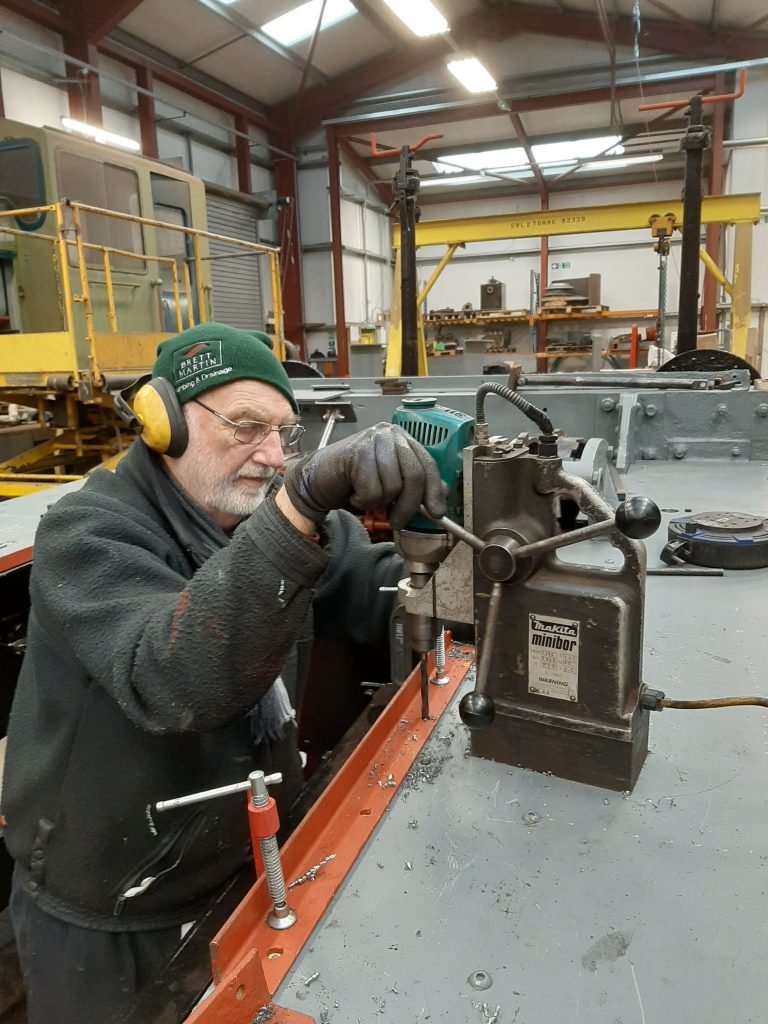 Phil Bell drills holes in Fluff's running board