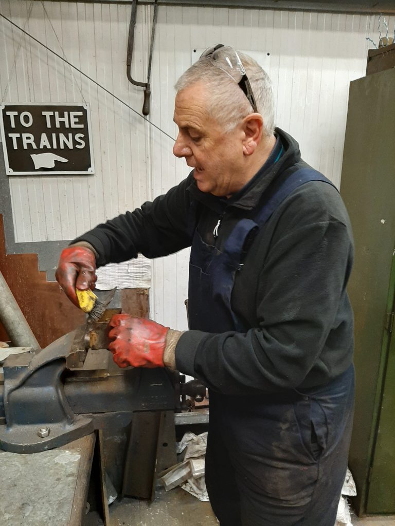 John Davis polishes up one of Fluff's lubrication boxes