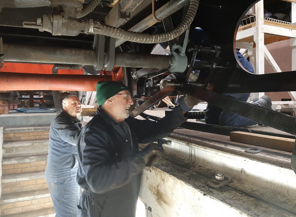 Phil Bell, John Davis and Roger Benbow in the process for re-assembling the brake gear on FR 20's tender