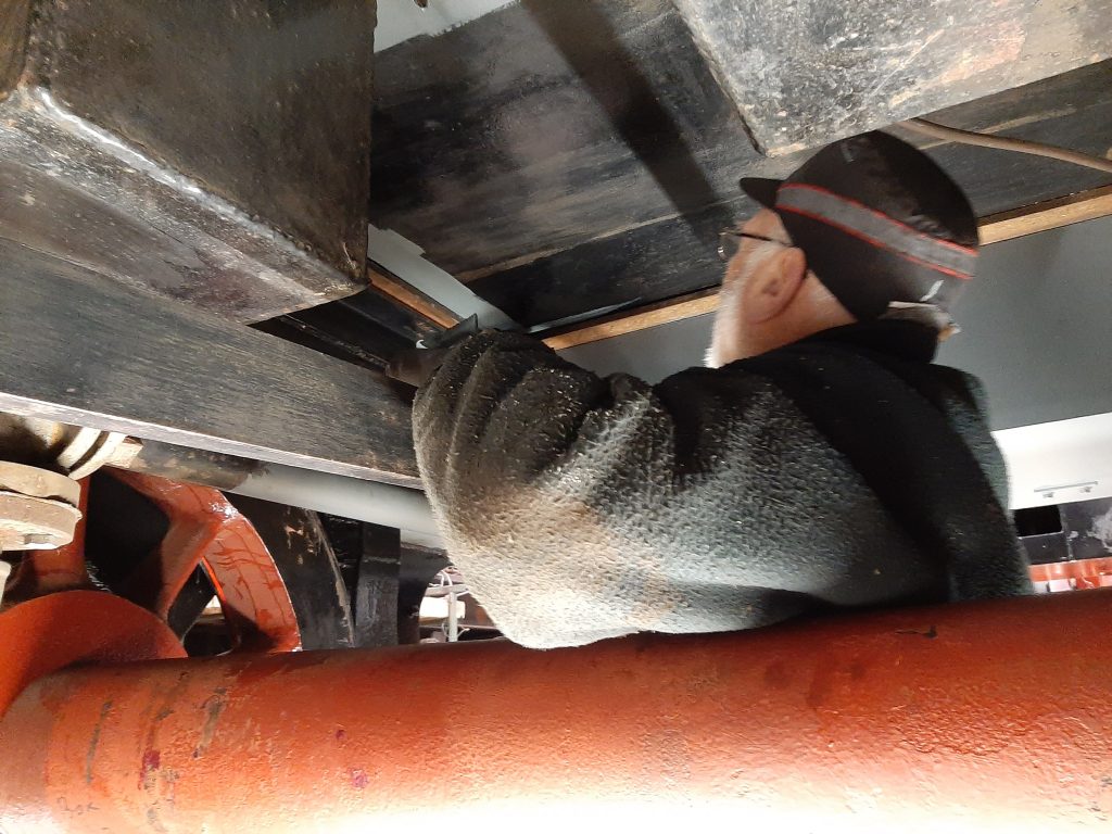 Phil Bell painting the underside of FR 20's tender