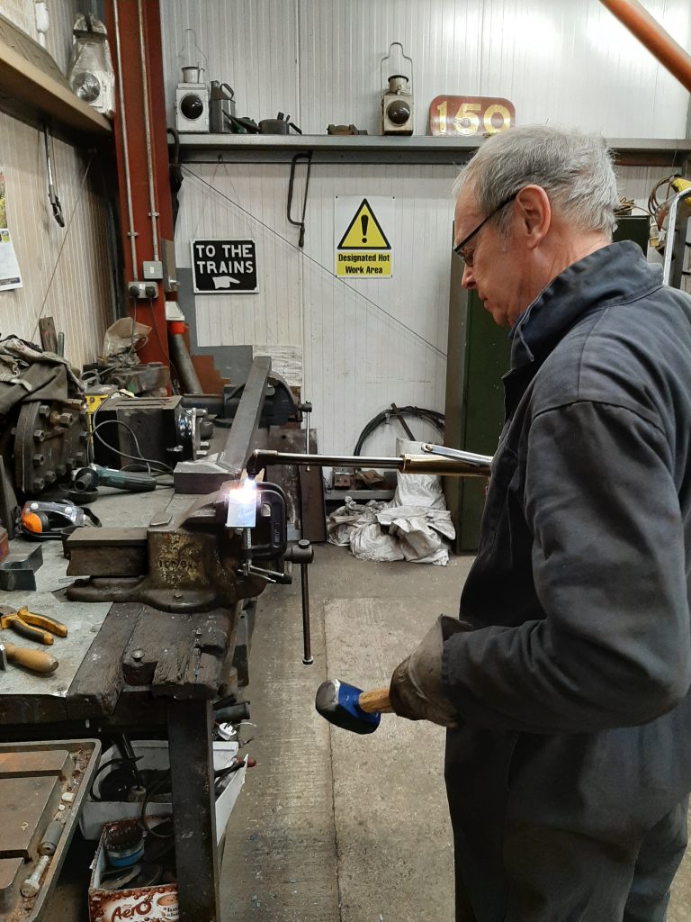 John Dixon then shapes the steel into a new bracket