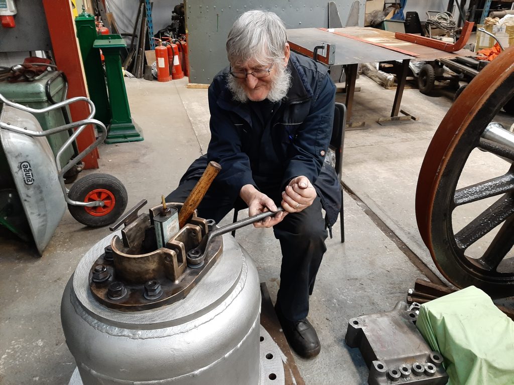 Alan removing the brass casting from the top of the dome