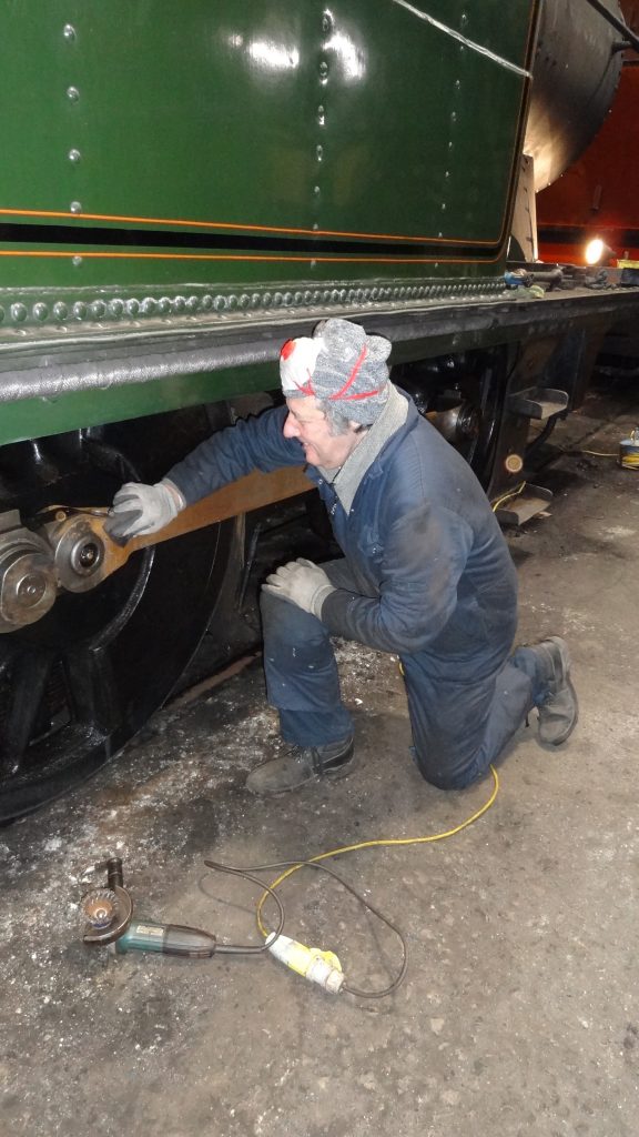 Mike Rigg polishes the coupling rods