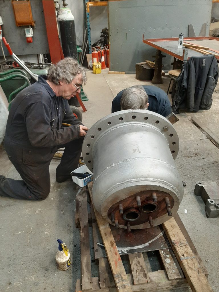 Ade and Alan in the process of removing the valve seats from FR 20's dome