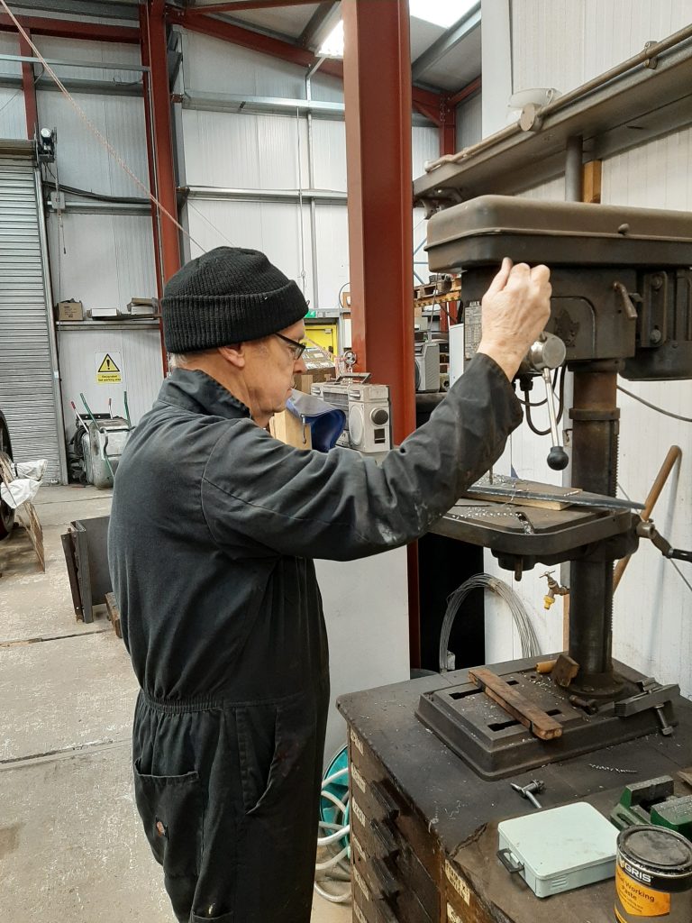 John Dixon drills some holes in a blank for FR 20's boiler