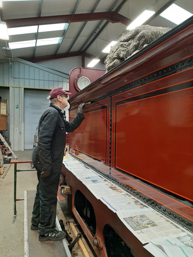 John Dixon checks for rivet head dribbles of varnish