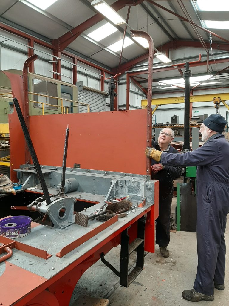 John Davis and Phil with Fluff's cab rear plate in position