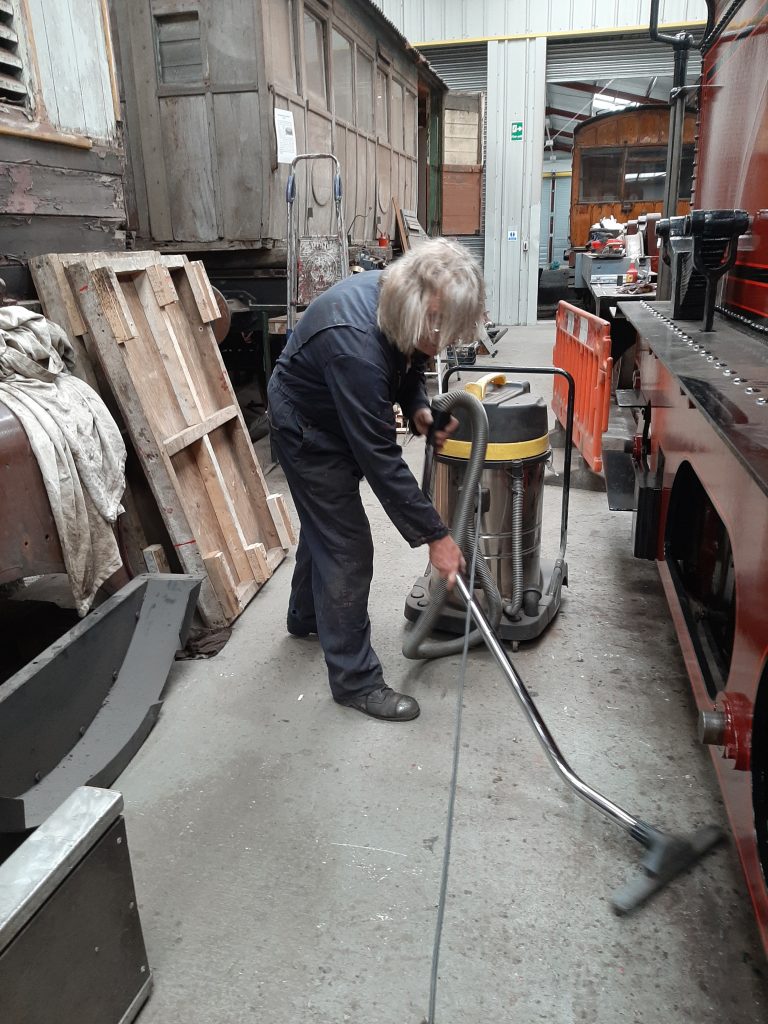 Ade hoovering the floor