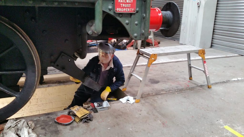 Phil Bell cleans 5643's right hand guard iron