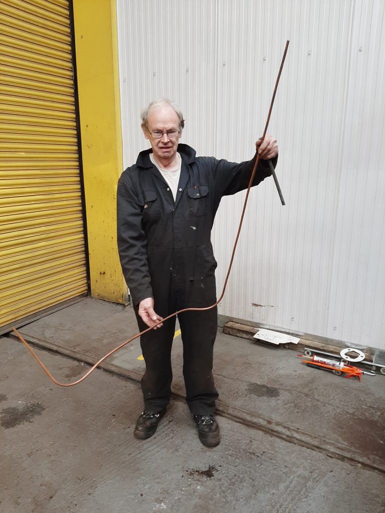 John Dixon with refurbed brake pipe for FR 20's tender