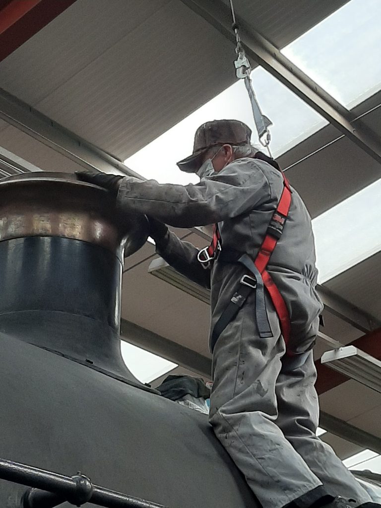 Fred atop 5643 cleaning the chimney