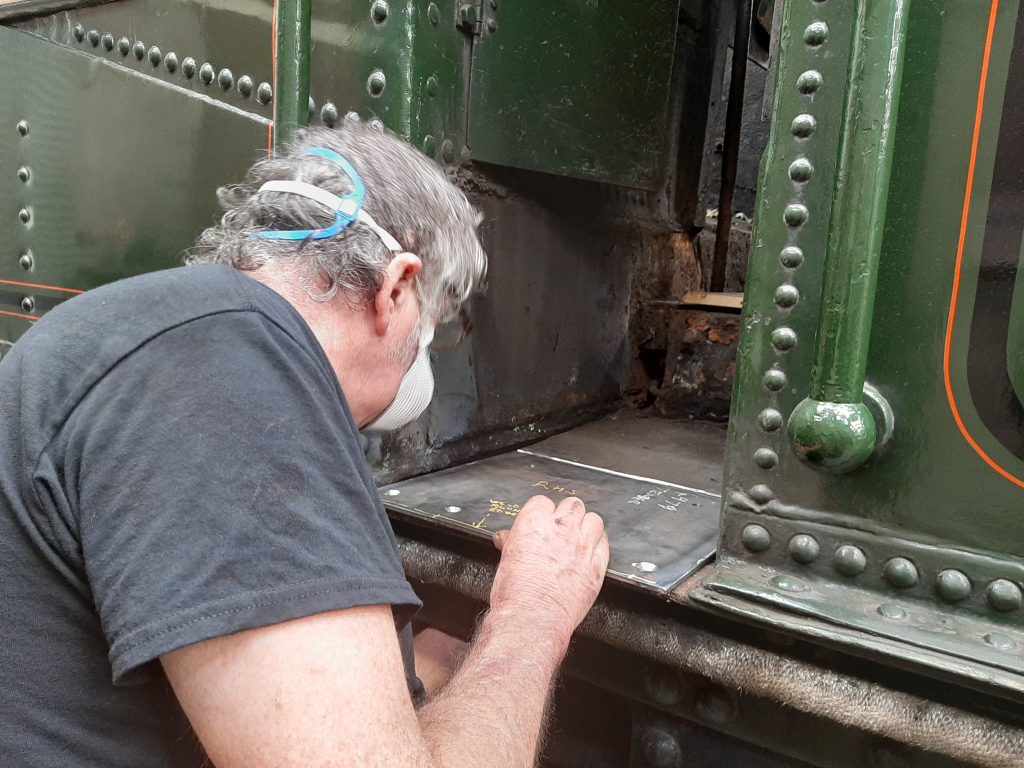 Keith making a new cab step plate for 5643