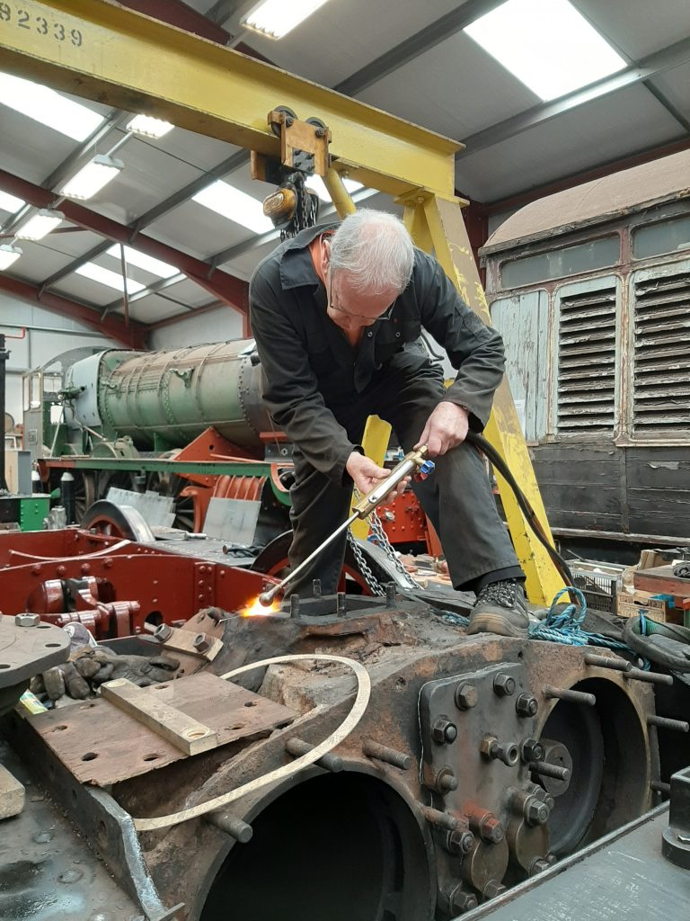 John Dixon applying heat to one of FR 20's blast pipe studs