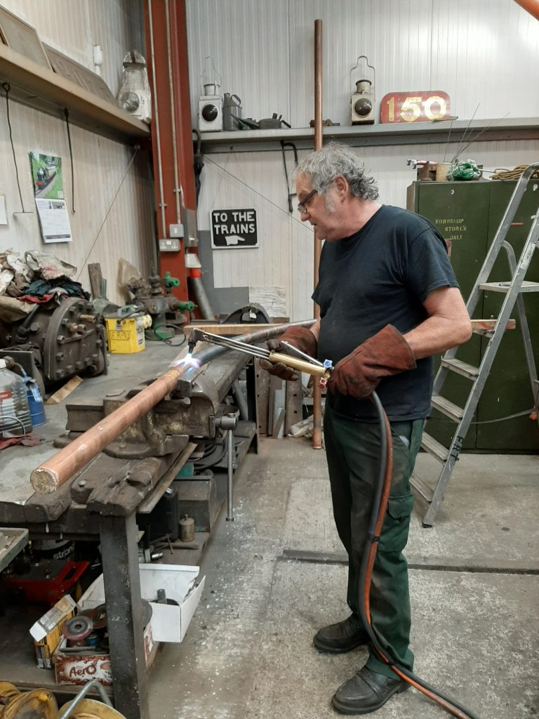 Keith shaping one of Wootton Hall's injector delivery pipes