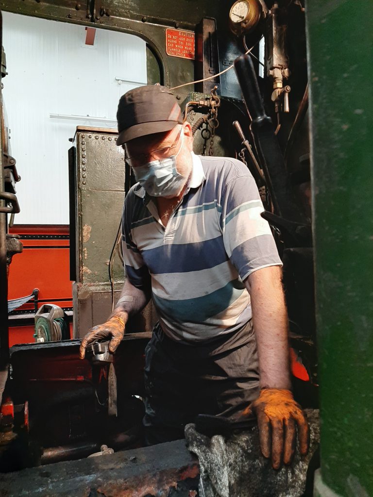 Phil Bell cleaning below 5643's cab floor