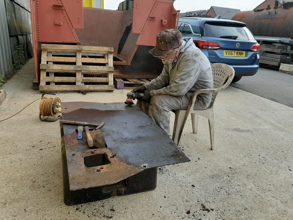 Fred cleaning up 5643's cab floor steelwork