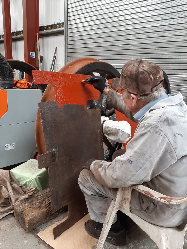 Fred painting some of 5643's cab floor metalwork