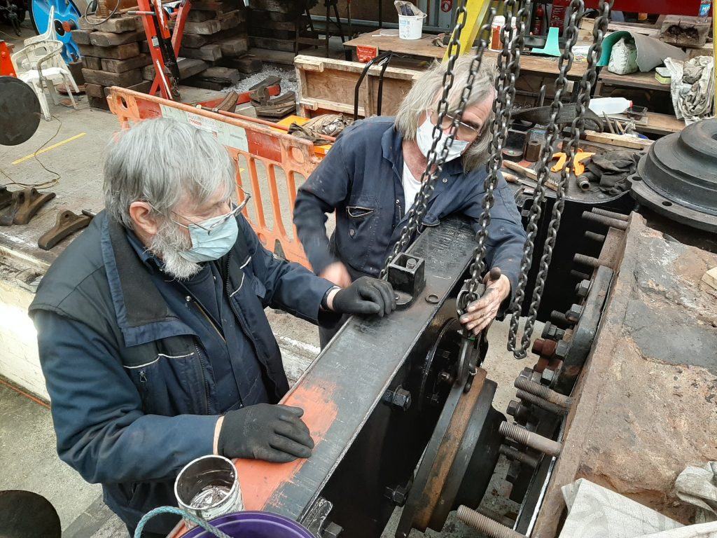 Alan and Ade attempting to re-fit the LH cylinder cover on FR 20