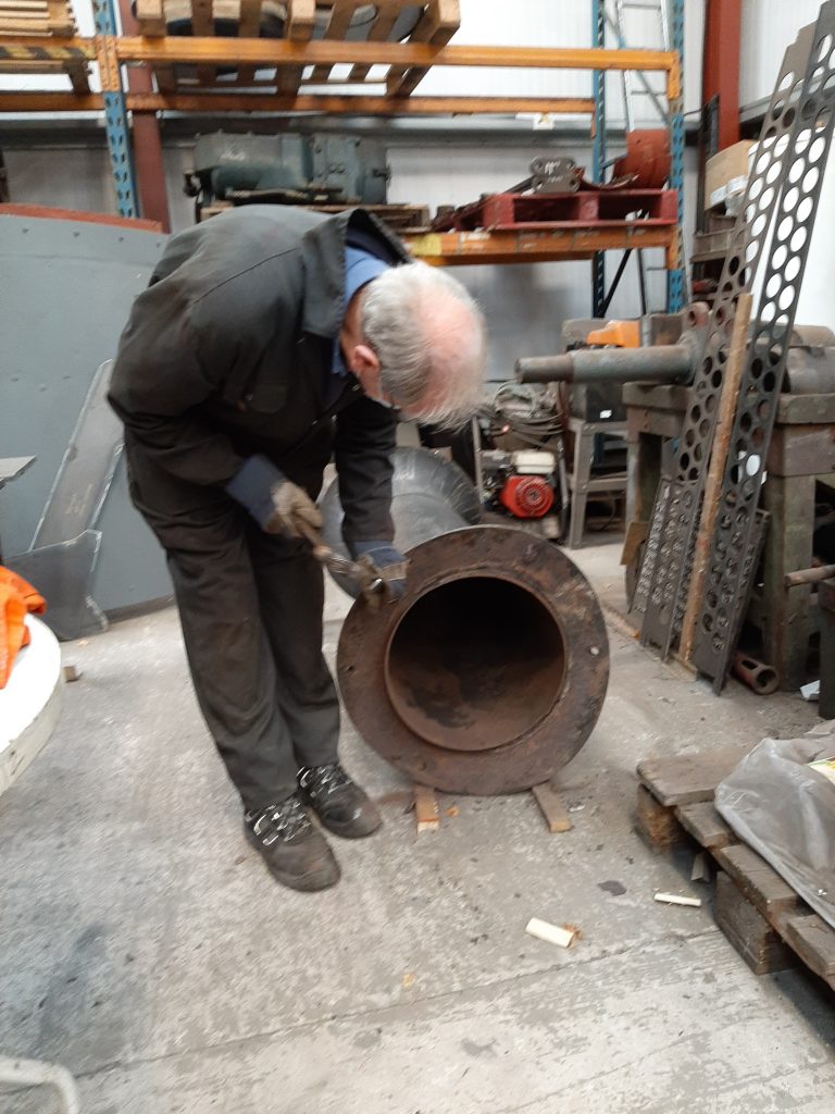 John Dixon cleaning the base of FR 20's chimney