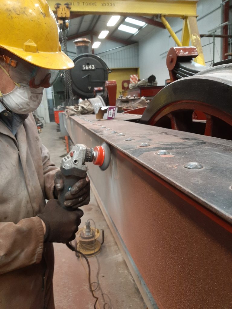 Fred removing paint from FR 20's left hand valance