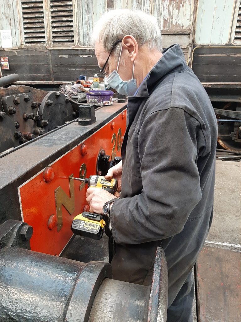 John Dixon removing the screws holding the numbers on FR 20's buffer beam