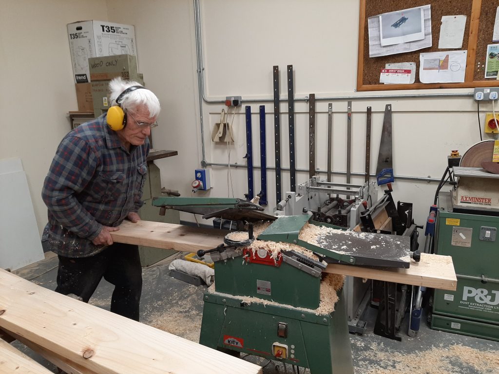 John Morgan planing the new wood for 5643's cab floor