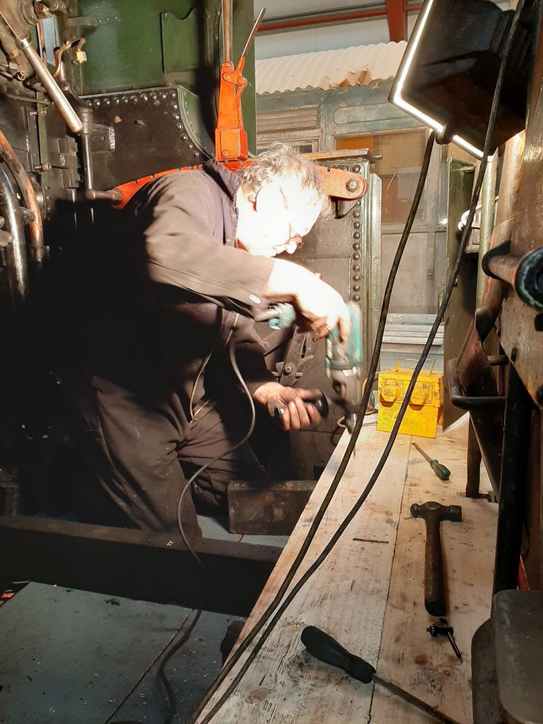 Keith fitting the new cab floor in 5643