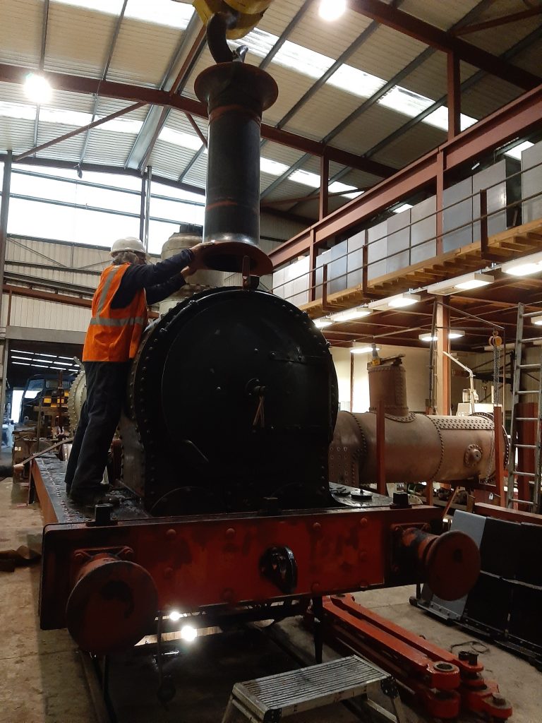 The chimney is lowered into place