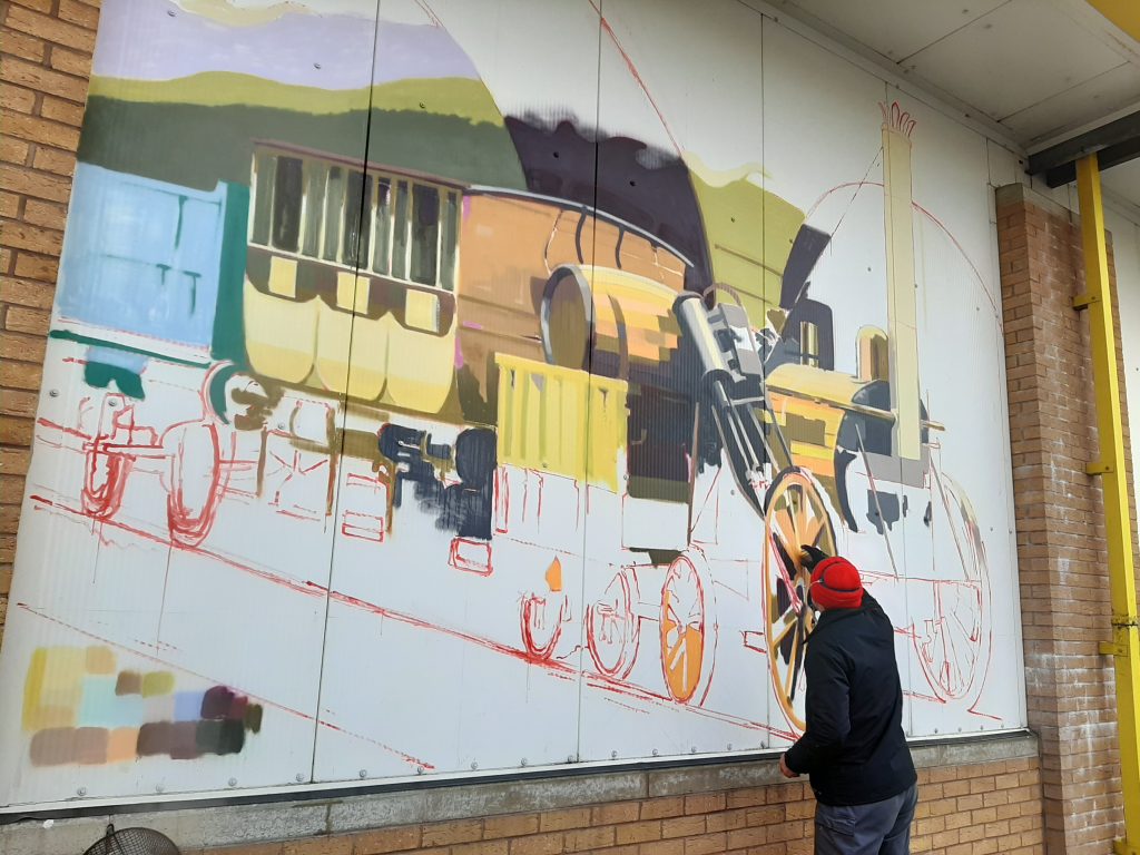 Gavin Renshaw working on the first of the RSR's timeline murals