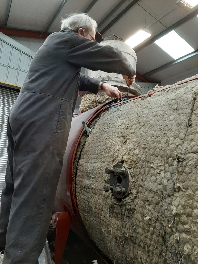 John Dixon completes the fitting of the boiler crinolines on FR 20