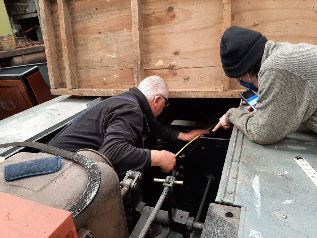 John Davis and Mike Rigg measuring up Fluff's engine compartment