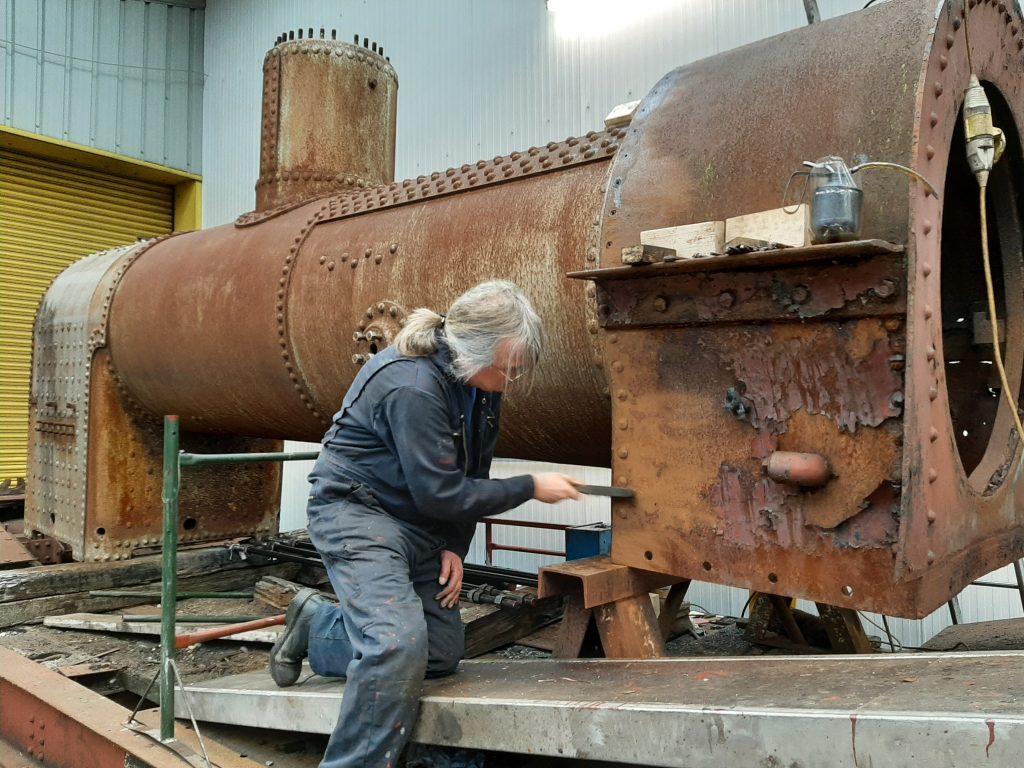 Ade fighting a losing battle with the rust on Caliban's smokebox