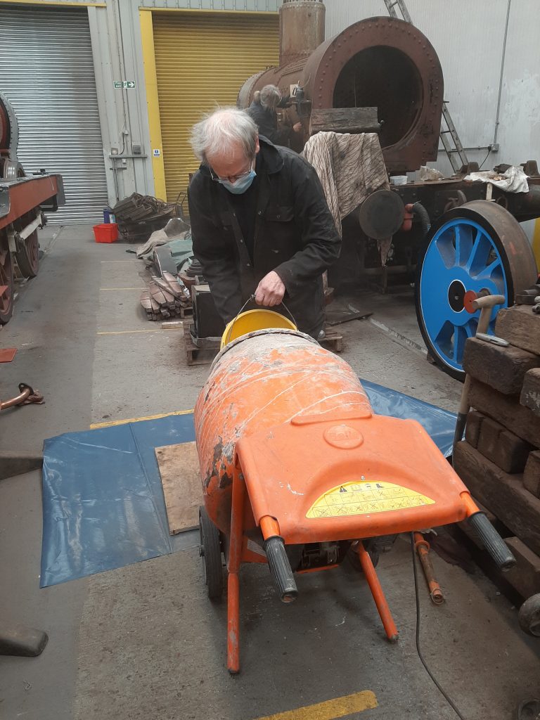 John Dixon busy with the concrete mixer