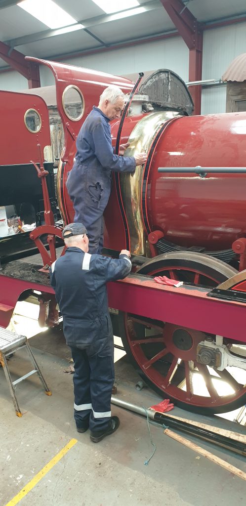 Tim and Ron Crowe fitting the decorative brass work on FR 20