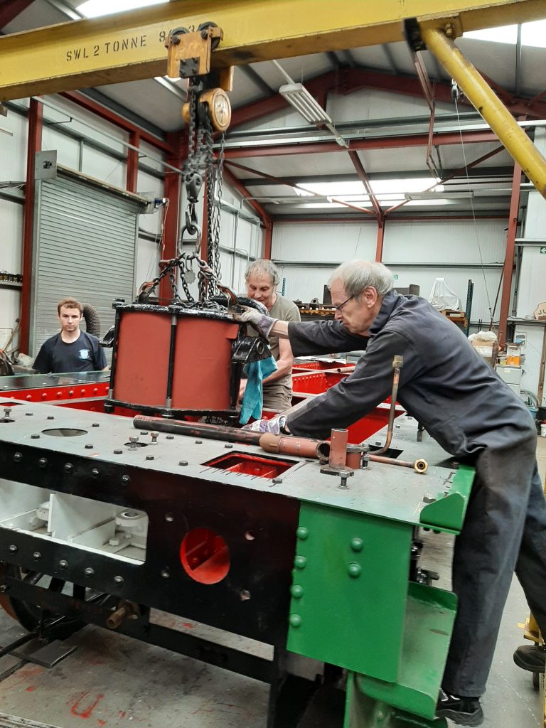 Lowering Wootton Hall's tender vacuum cylinder into the tender frames