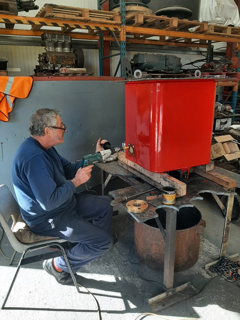 Keith drilling holes in Wootton Hall's tender water take off tank