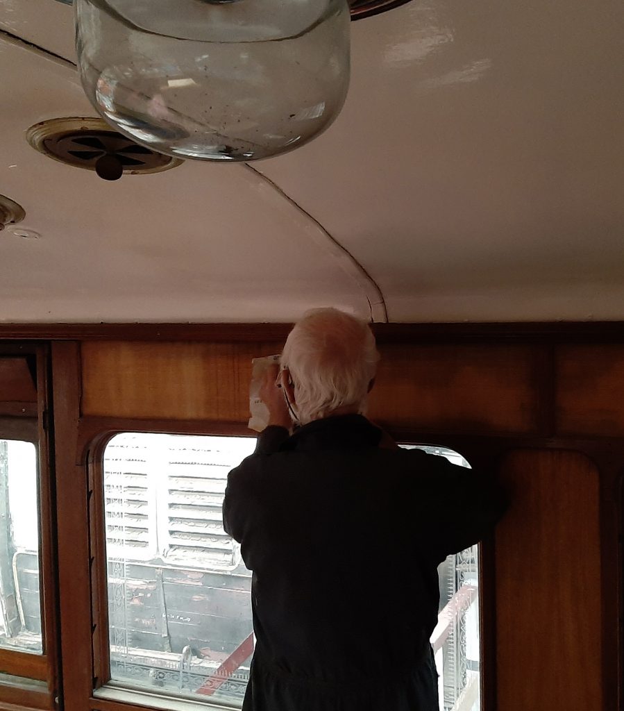 Roger cleaning stained wood