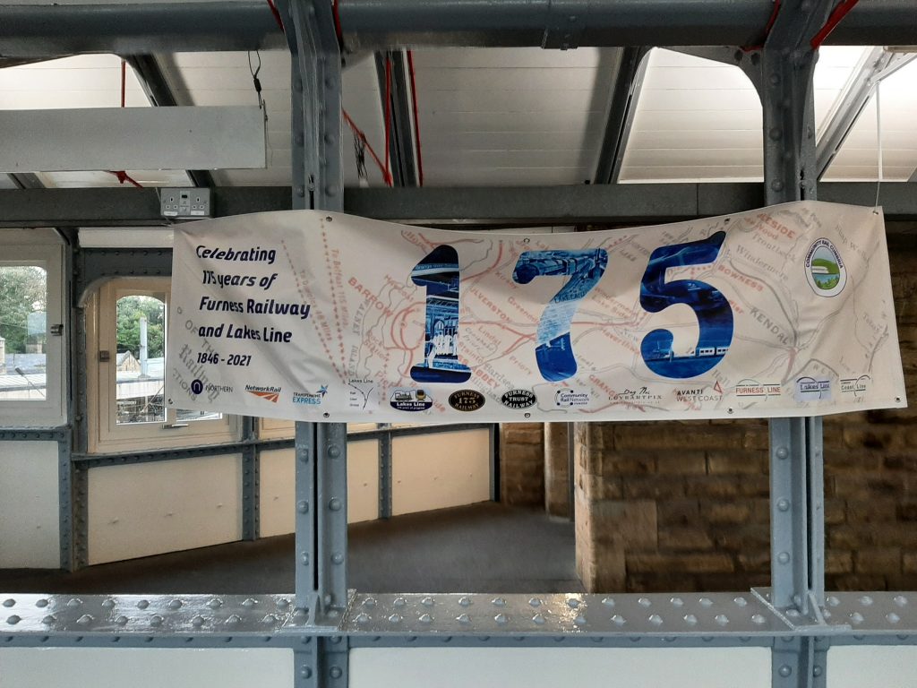 The 175 celebrations banner on Lancaster Station footbridge
