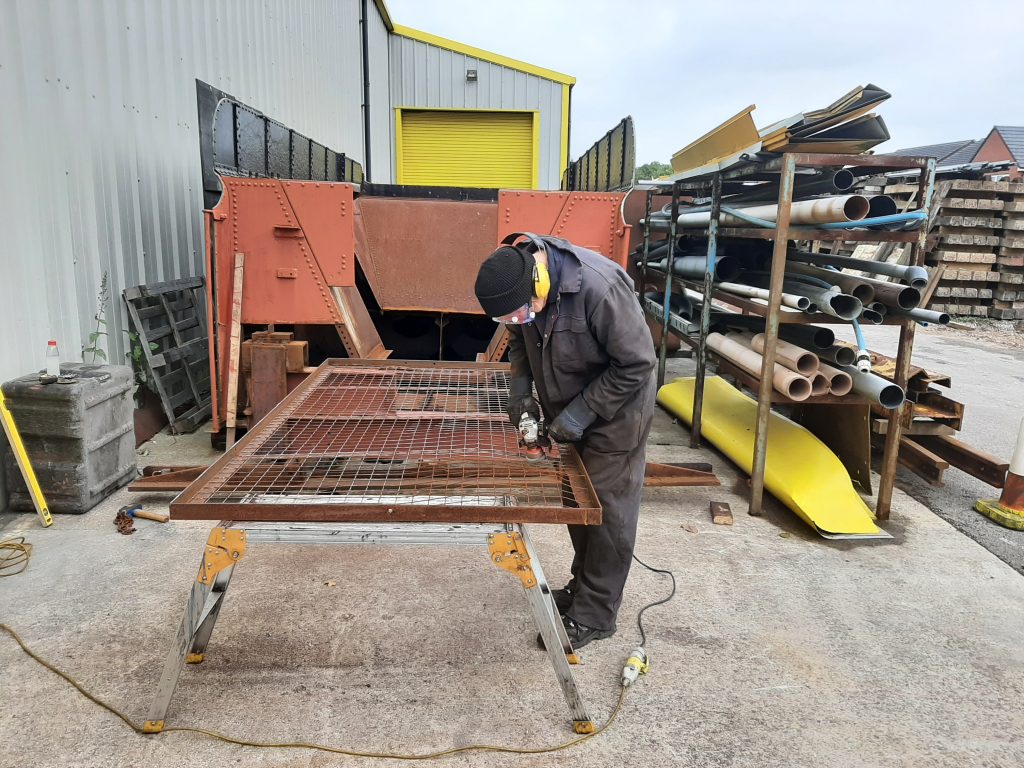 John Dixon working on the new lock up cage for the FRT's gas bottles